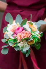 Wedding bouquet in hands of the woman