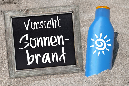 Sonnencreme Sonnenmilch UV-Schutz im Sand Tafel Sonnenschutz