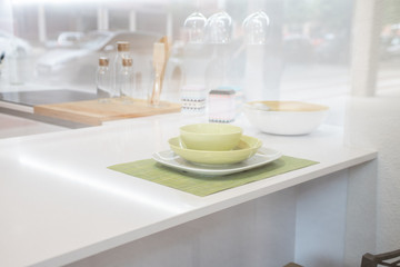 Obraz na płótnie Canvas Empty plate on kitchen table background. View of the kitchen