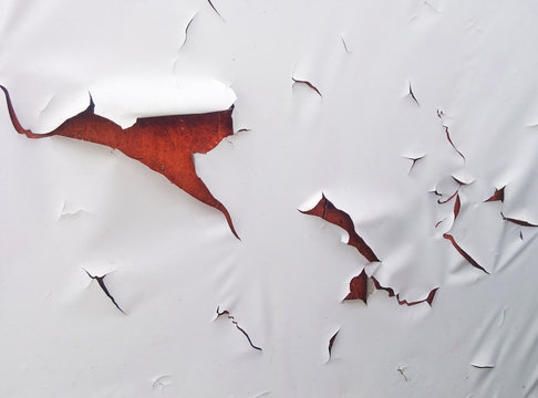 Cracked wall with old layers of paint