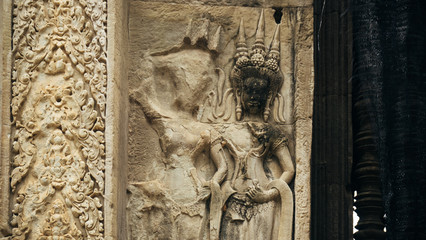 Sandstone sculpture, Apsara the angel of Cambodia in black face. Angkor Wat, Siem Reap, Cambodia.