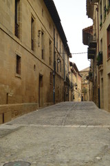 Fototapeta na wymiar Picturesque And Narrow Streets On A Cloudy Day In Briones. Architecture, Art, History, Travel. December 27, 2015. Briones, La Rioja, Spain.