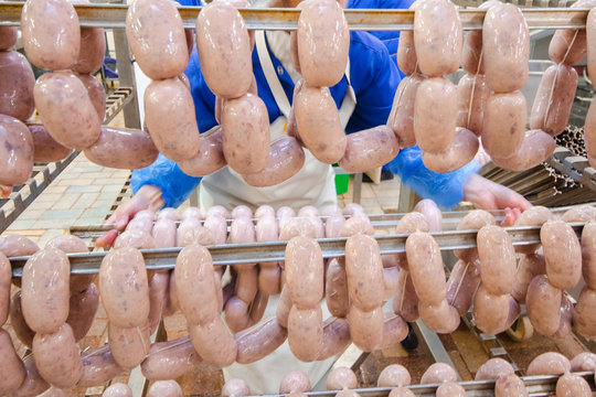 Sausage. Sausage production line. Process of sausage manufacturing. Industrial manufacturing of sausages. Meat shop