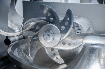 Cutter. Industrial cutter for grinding meat. Factory for the production of sausages and meat delicacies. Background