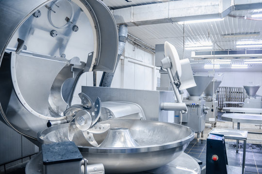 Cutter. Industrial cutter for grinding meat. Factory for the production of sausages and meat delicacies. Background