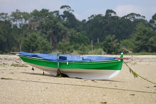 wooden fishing boat dries ashore