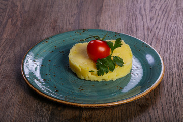Mashed potato served tomato
