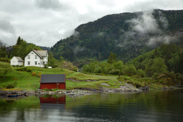 Fototapeta na wymiar Low clouds in the fjord of Bergen in Norway