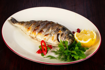 Grilled dorada served lemon