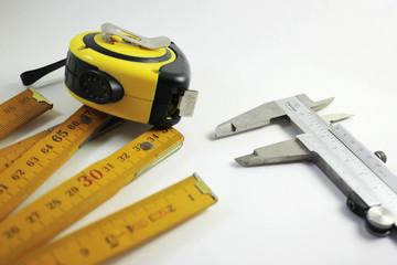 Tape measure caliper and extendable ruler