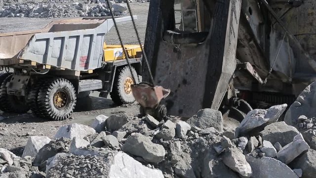 Mining excavator loading rocks 01 / Mining excavator loading rocks into a truck