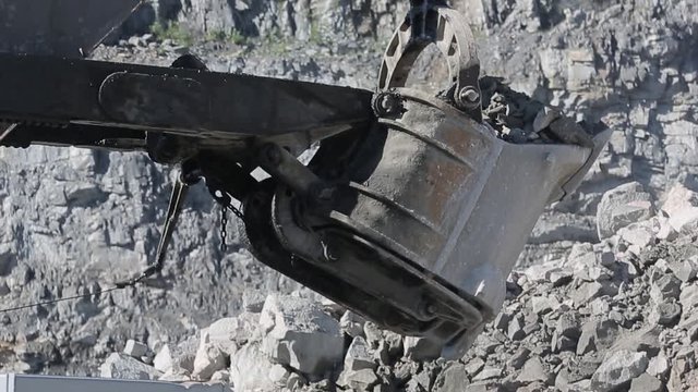 Mining excavator loading rocks 03 / Mining excavator loading rocks into a truck