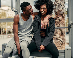 Naklejka premium Young happy black couple outdoors