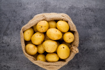 A bio russet potato wooden vintage background.
