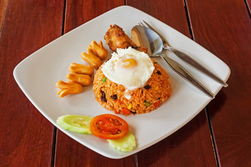 Fire rice with egg on white plate