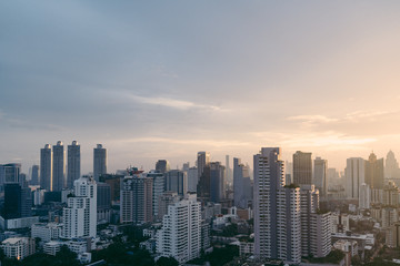 Bangkok cityscape after the rain in the evening with sun going down.