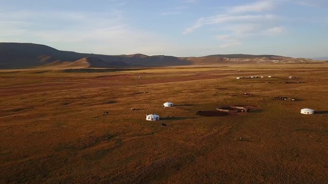Aerial view from a drone of traditional gers in a Mongolian steppe on an autumn day. Lake Khuvsgol, Mongolia.