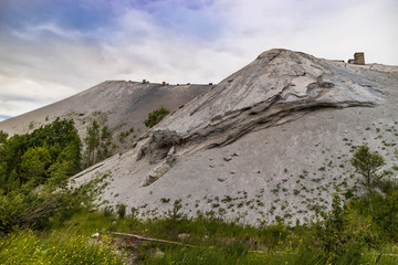 Oil shale ash heap in Estonia, dangerous toxic waste outdoors near the city.