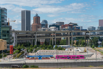 Lightrail train travels through the city of Portland, OR
