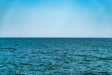 Fototapeta premium Horizon of the sea. Blue water and sky