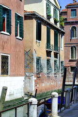 Beautiful architecture  Venice, Italy. Details of the windows and doors of the colorful houses. Street. Grand canal famous landmark panoramic view Venice Italy with blue sky white cloud.