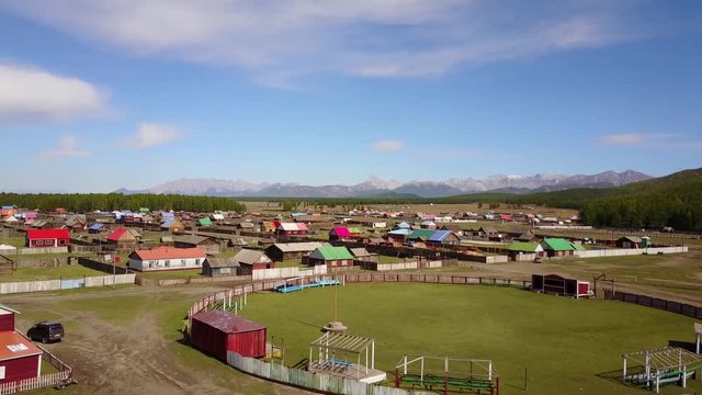 Aerial view of a colorful rural village on a suny day in the countryside of Khuvsgul, Mongolia.