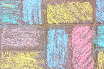 Drawing with colored chalk on the asphalt.