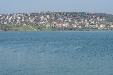 Settlement on the shore of the pond