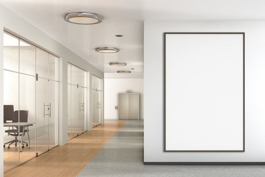 Blank poster on the wall in modern office