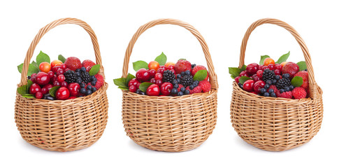 Fototapeta na wymiar Fresh forest berries in basket isolated on white background with clipping path