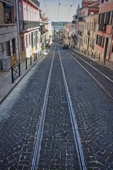Lisbon high slope street with rail tracks