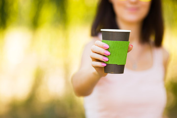 nice girl with a paper cup of coffee