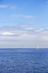 Two sailing boats in the Maltese Mediterranean water of Marsamxett Harbor