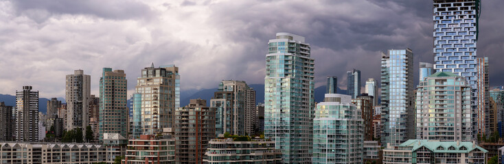Fototapeta na wymiar Panoramic view of Downtown City Buildings during a vibrant evening. Taken in Vancouver, British Columbia, Canada.