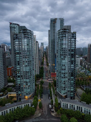 Aerial view of high rise buildings in Downtown City during a cloudy sunrise. Taken in Vancouver, BC, Canada.