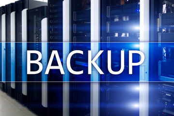 Backup button on modern server room background. Data loss prevention. System recovery.