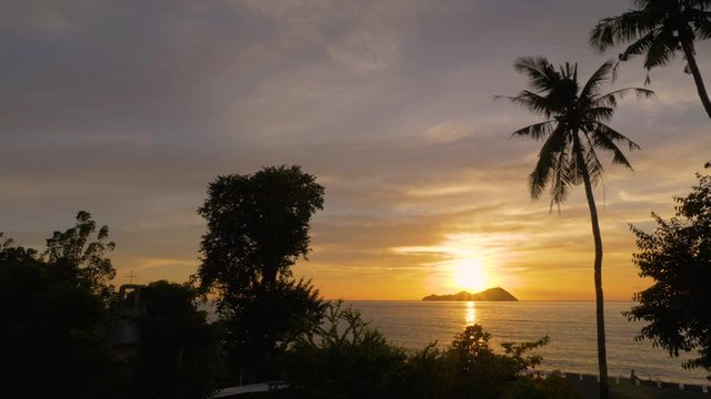 Sundown over the island of Mararison or Malalison in the Philippines