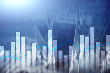 Financial graphs and charts on blurred business center background. Invesment and trading concept.