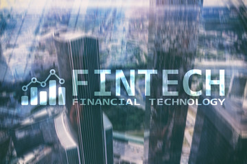 FINTECH - Financial technology, global business and information Internet communication technology. Skyscrapers background. Hi-tech business concept.