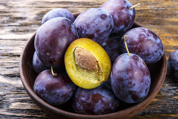ripe plum on a wooden background