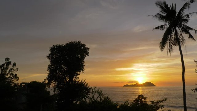 Sundown over the island of Mararison or Malalison in the Philippines