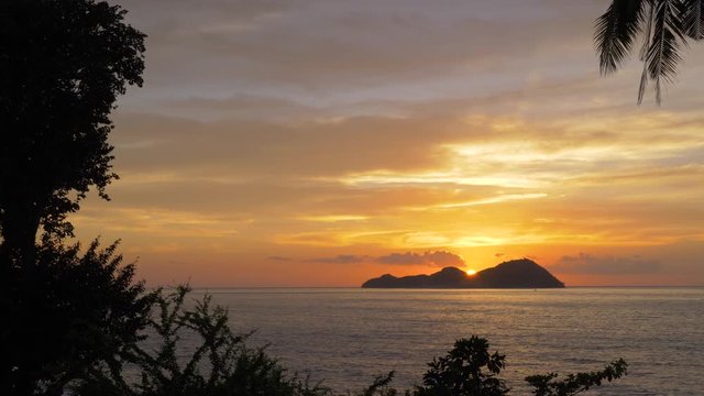 Sundown over the island of Mararison or Malalison in the Philippines