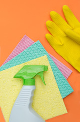 Three sponges and a bottle of spray for cleaning