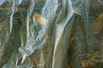 brown texture from a piece of dirty transparent cellophane