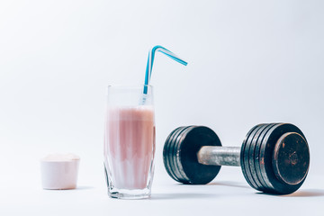 Glass of protein shake with a straw