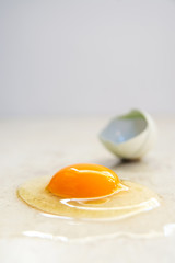 Organic Egg is Being Broken on Smooth Countertop