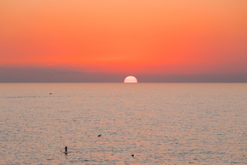 Sun Goes Down Over the Horizon Sea