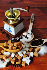 Grains of coffee and white and brown lump sugar