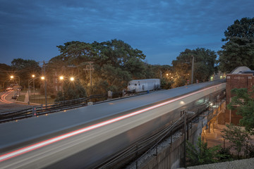 Train whizzing by neighborhood