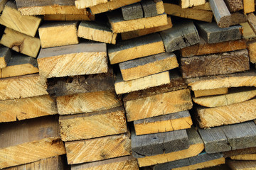 Sawn old boards for firewood. Pile of firewood. Close-up. Background. Texture.